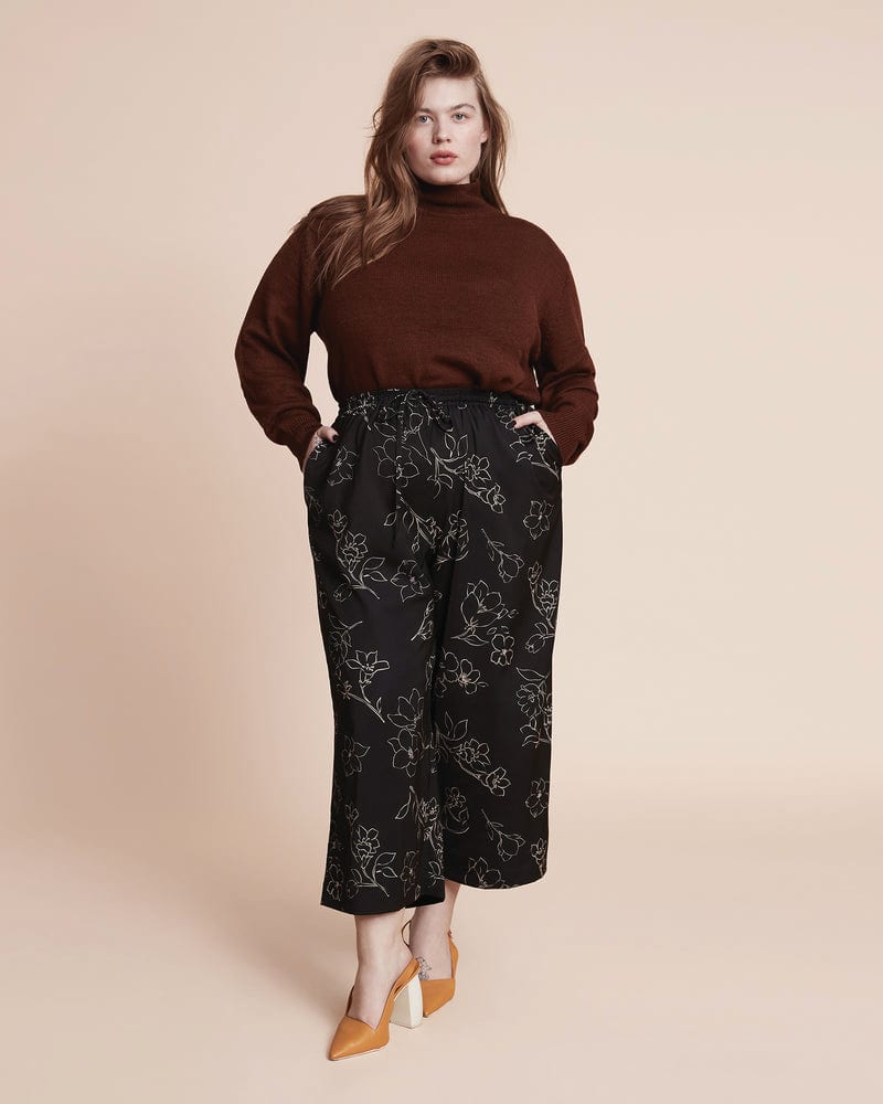 Front of a model wearing a size 12 Ravyn Culotte Pant in Black Multi by 11 Honoré Collection. | dia_product_style_image_id:314772
